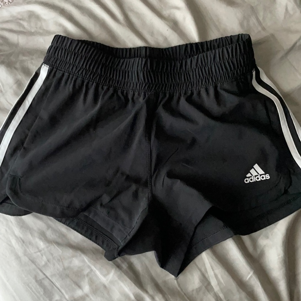 Black Adidas shorts with white stripes. Size 2XS